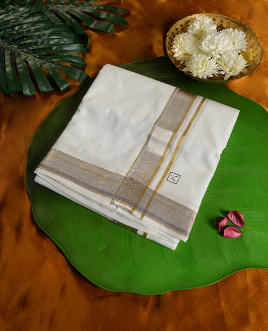Off white colour pure cotton dhoti adorned with an elegant golden zari border and subtle silver detailing, giving it a rich and graceful finish & Ideal for weddings, festive occasions, and cultural ceremonies.