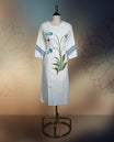 Off white colour kurthi with elegant pastel blue floral prints and leafy patterns on the front, accented by striped detailing on the sleeves, Perfect for a stylish yet comfortable casual or semi-formal look.