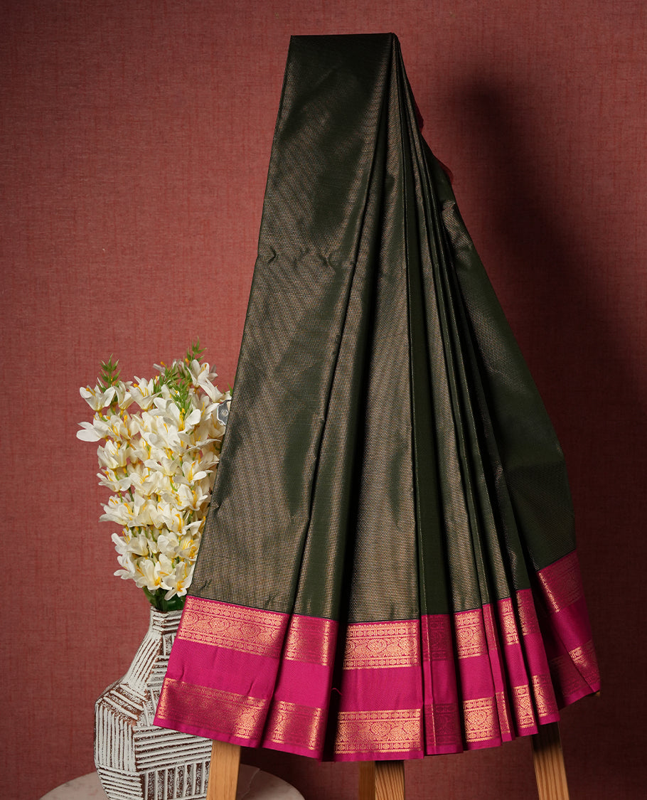 Green colour Semi Silk Saree with Plain Textured Body, Contrasting Magenta Pink Golden Zari Pallu & Border, Traditional Diamond Motifs, and Matching Blouse Piece