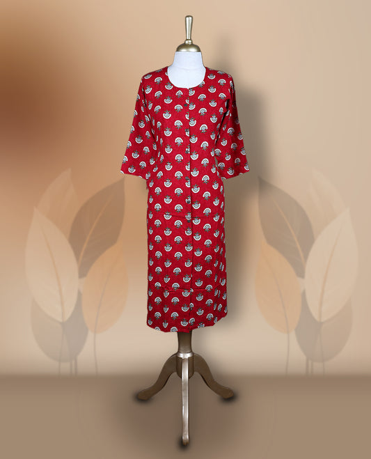 Red kurti featuring a round neckline, 3/4th flared sleeves, and an all over white and teal floral motif print, styled in a straight cut silhouette for a vibrant and elegant casual wear look.