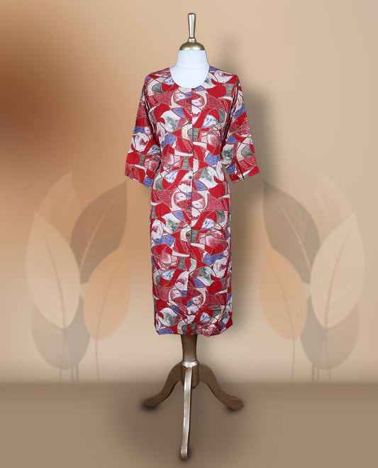 Red colour kurti featuring a round neckline with button detailing, 3/4th sleeves, and an all over floral print in blue and beige, designed in a straight cut silhouette for a simple and elegant everyday look.