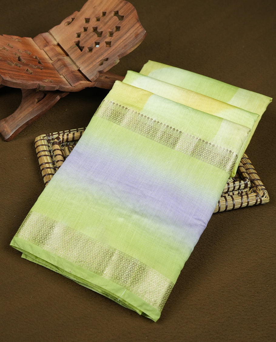 Pastel yellow green colour mixed chanderi cotton saree with wavy body, golden zari border, lavender-gray border accents, and matching blouse.