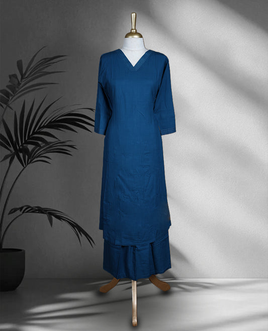 Cobalt blue colour cotton cord set with a straight cut kurta featuring a V neckline and 3/4th sleeves, paired with flared bottoms.