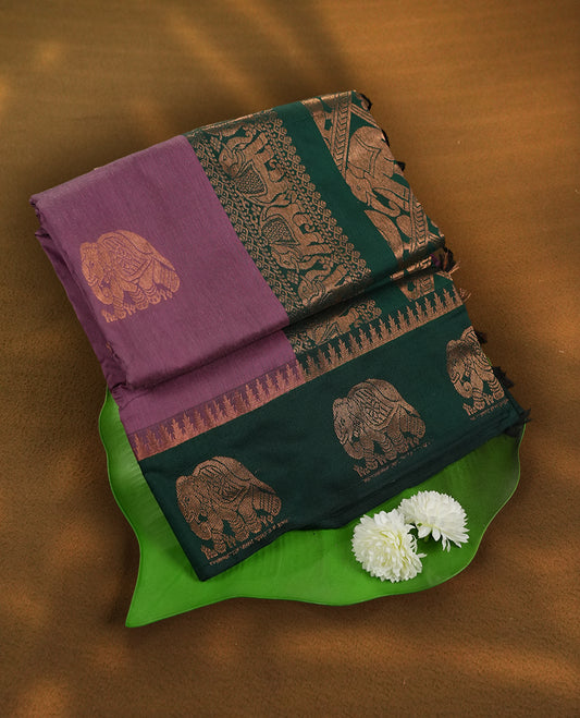 Plum colour Kalyani Cotton saree in forest green pallu,antique gold elephant motifs and temple borders & Comes with a matching blouse piece.