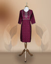 Dark magenta colour kurthi adorned with intricate embroidery on the yoke and delicate floral patterns all over, Designed with a 3/4th sleeves, perfect for casual and semi formal occasions.