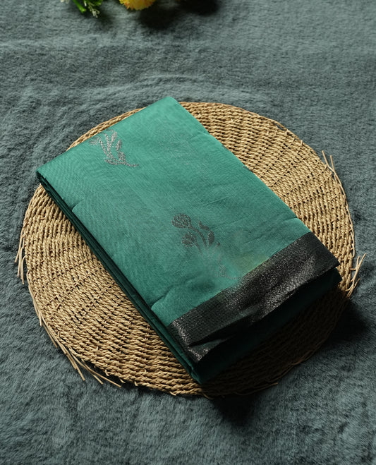 Teal Colour Silk Cotton Saree with Silver Floral Butta Body, Contrasting Silver Zari Pallu & Border, Floral Vine Motifs, and Matching Plain Woven Blouse Piece