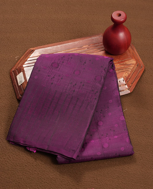 Purple colour Semi Soft Silk Saree Featuring a Self Coloured Patterned Body, Complemented by Self Coloured Pallu & Border and a Matching Blouse Piece