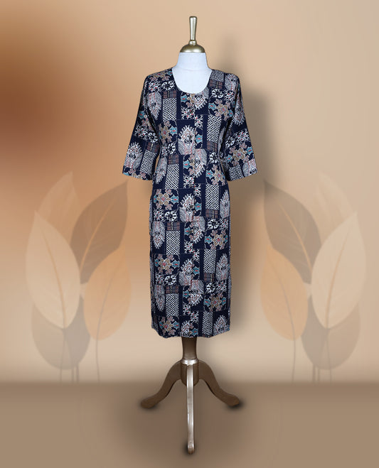 Navy blue colour kurthi adorned with delicate floral prints, featuring a round neckline and three quarter sleeves & Crafted for comfort and style, perfect for casual and semi formal occasions.