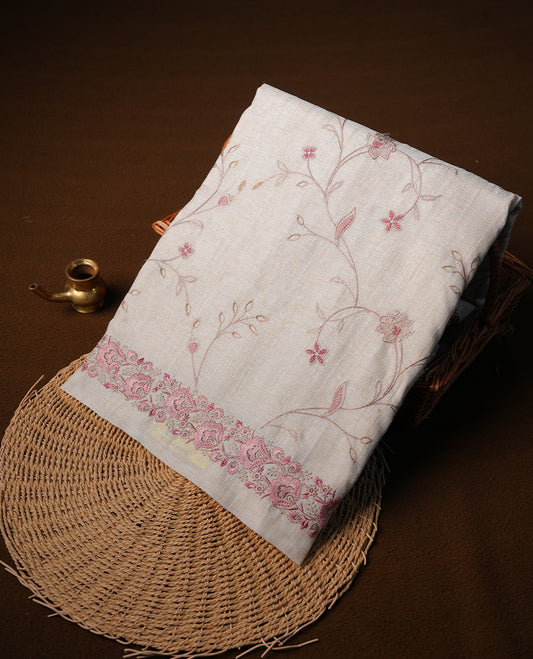 Cream colour semi tusser silk saree featuring with Pink colour thread embroidery kodi pattern all over body, pallu, border  and paired with matching blouse piece.
