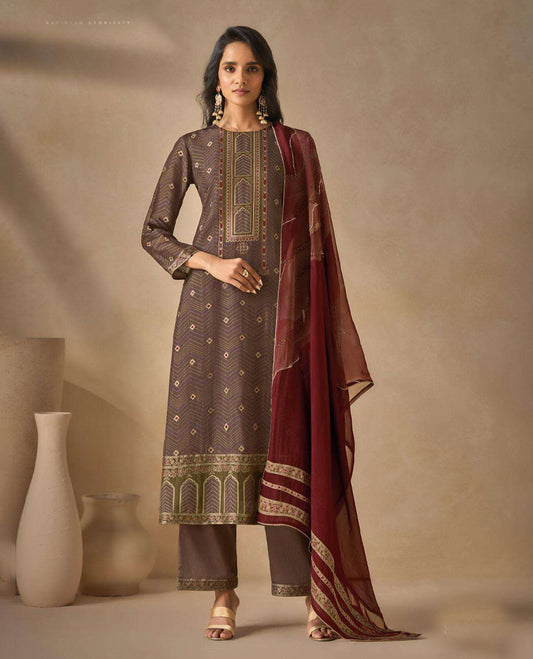 Brownish Gray colour suit material with silk jacquard digital print top with embroidery highlighted sleeve work, paired with matching satin bottom and a contrast lightweight printed dupatta.
