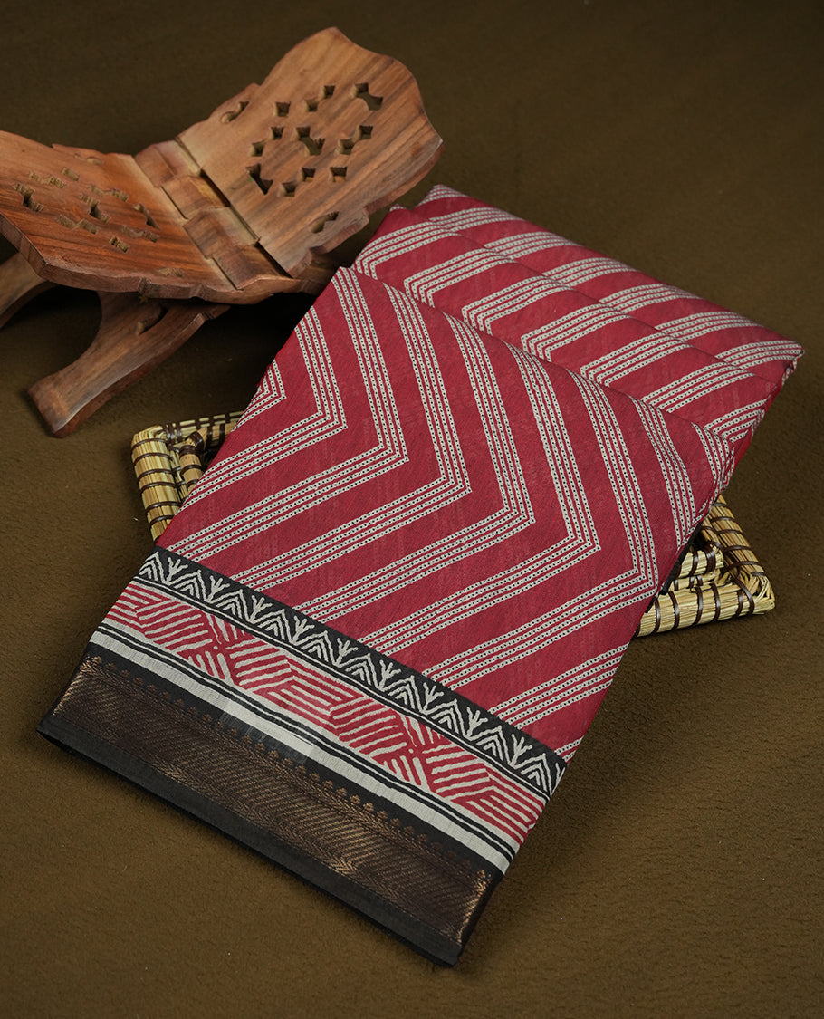 brick red colour mixed chanderi cotton saree with zigzag body pattern, printed geometric pallu with floral border, golden zari border, matching brick red blouse.