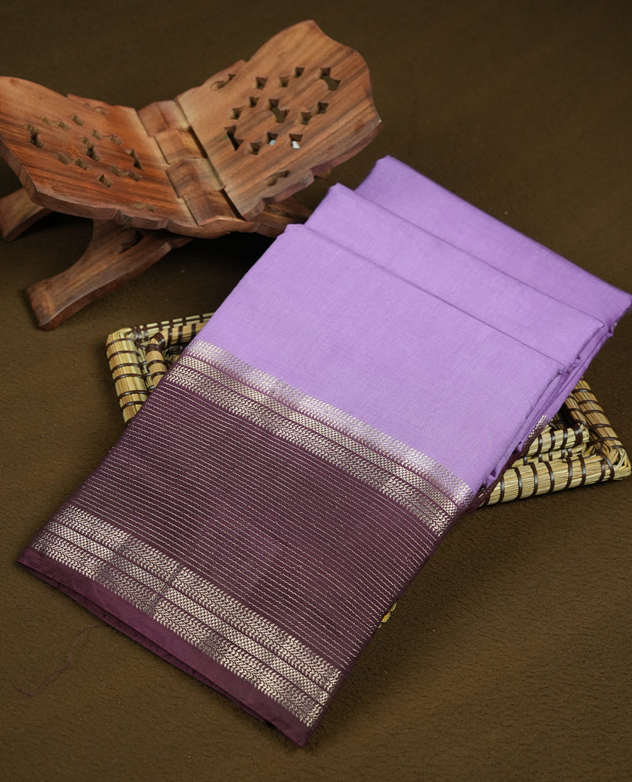 Lavender colour mixed chanderi cotton saree with plain body, chocolate brown pallu with silver zari border and geometric motifs, and matching blouse