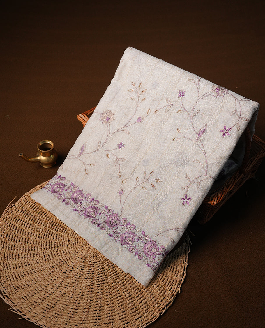 Cream colour semi tusser silk saree featuring with Lavender colour thread embroidery kodi pattern all over body, pallu, border  and paired with matching blouse piece.