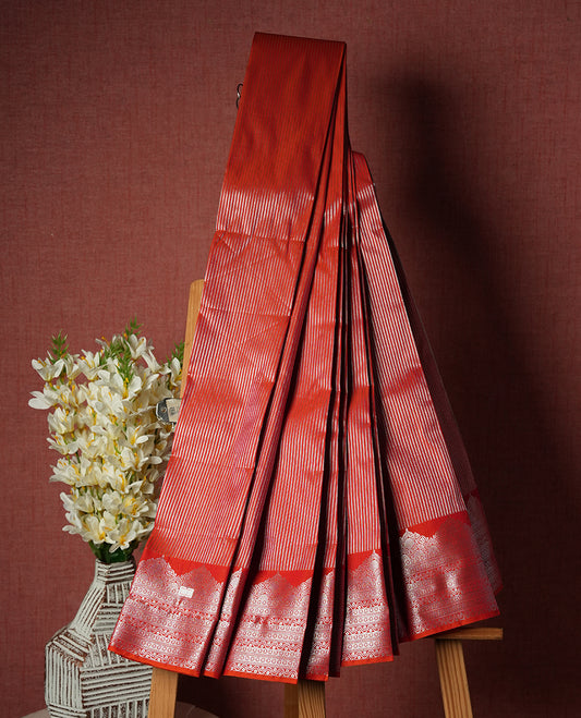 Tomato Red Colour Semi Silk Saree with Silver Striped Body, Self Coloured Silver Zari Pallu & Border, Ornate Scallop Motifs, and Matching Blouse Piece