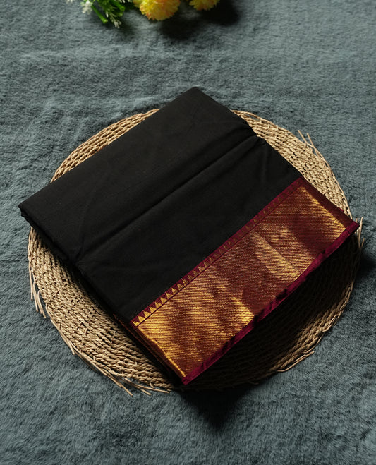 Black colour Narayanapattu cotton saree featuring a self coloured body, maroon coloured with gold zari pattern border and gold striped colour pallu, pairing a matching blouse piece.