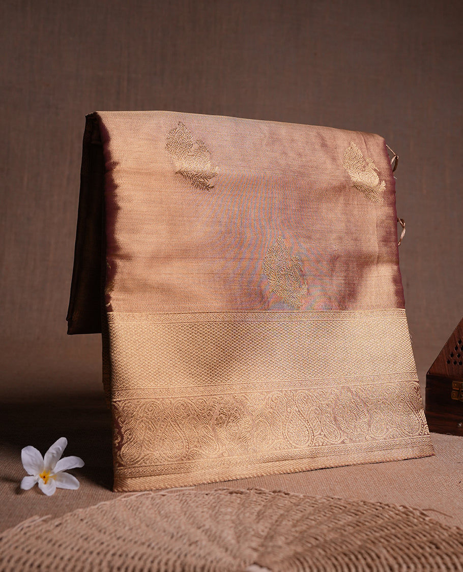Antique Gold colour tissue banaras silk saree featuring antique gold zari motifs on the body with rich traditional zari border and pallu, paired with a matching blouse piece.