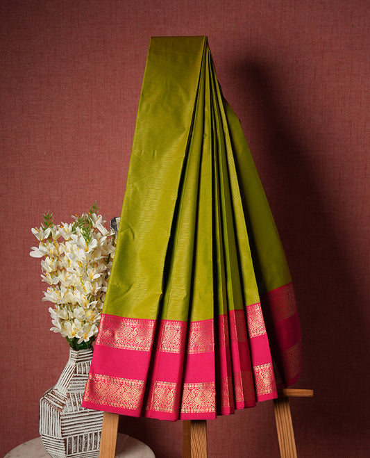 Lime green colour Semi Silk Saree with gold zari striped patterns on the body, paired with a contrasrich maroon traditional pallu and border, and a matching blouse piece.