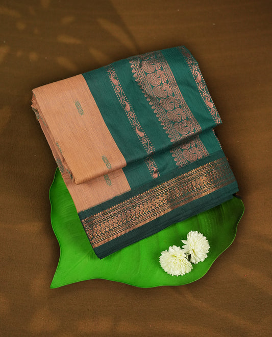 Pastel Orange colour Kalyani cotton saree with intricate small motifs all over, paired with a contrasting dark green rich zari woven border and pallu & Comes with a matching blouse piece