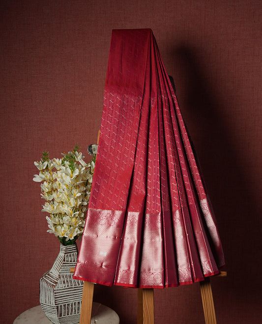 Crimson Red Colour Semi Silk Saree with Silver Dotted Striped Body, Contrasting Rose Gold Zari Pallu & Border, Traditional Paisley Motifs, and Matching Blouse Piece