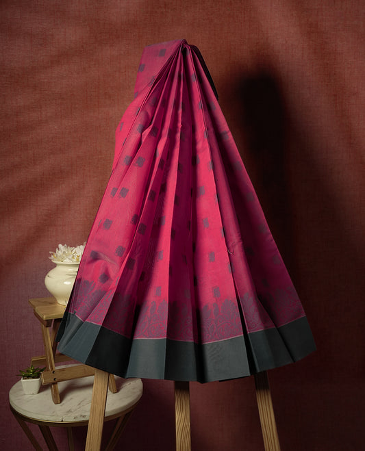 Rouge Pink colour silk cotton saree adorned with delicate woven motifs all over the body, paired with an elegant dark plain grey border and richly patterned pallu & Comes with a matching blouse piece for a complete ethnic look.