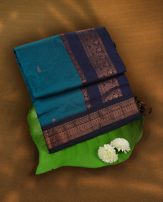 Blue colour Kalyani Cotton saree with rich navy blue border and pallu, featuring copper zari motifs and intricate weaving & Includes a matching blouse piece.