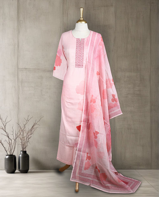 Pastel pink colour salwar from TWARA, featuring a embroidered neck with peach colour bold floral thread work on the top, paired with a matching bottom and an elegant dupatta.