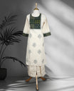 Off white colour cord set with delicate grey motifs, featuring a round neck top with patchwork detail in green and black, and matching embroidered straight fit pants.