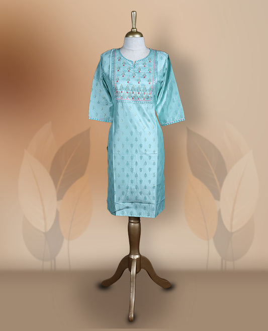 Light blue silk blend kurthi with intricate embroidered yoke, subtle butti prints, and elbow length sleeves & A perfect blend of tradition and style for festive or casual wear.