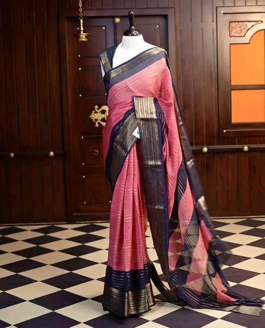 Onion Pink colour semi Banarasi saree featuring elegant gold zari stripes on the body, a contrasting Navy Blue border adorned with intricate gold zari work, and a rich pallu, Paired with a matching blouse