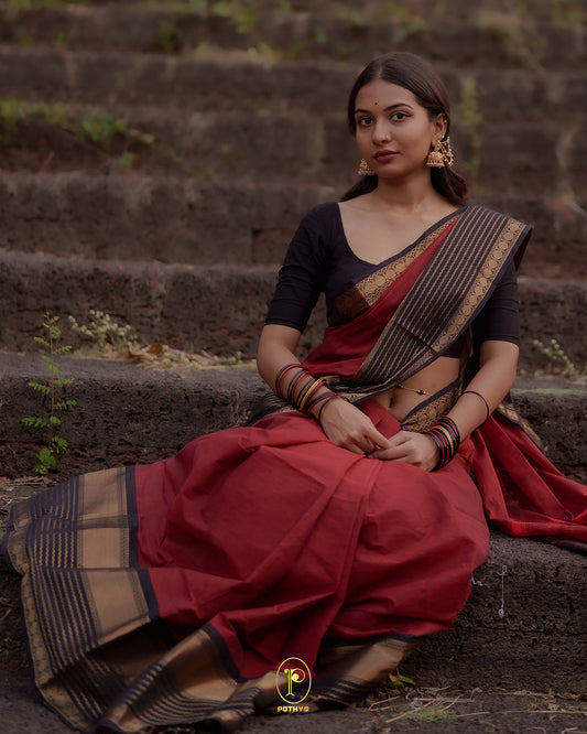 Brick Red colour Chettinad cotton saree with a plain body, featuring a traditional border and pallu in Dark Brown colour, paired with a matching blouse piece