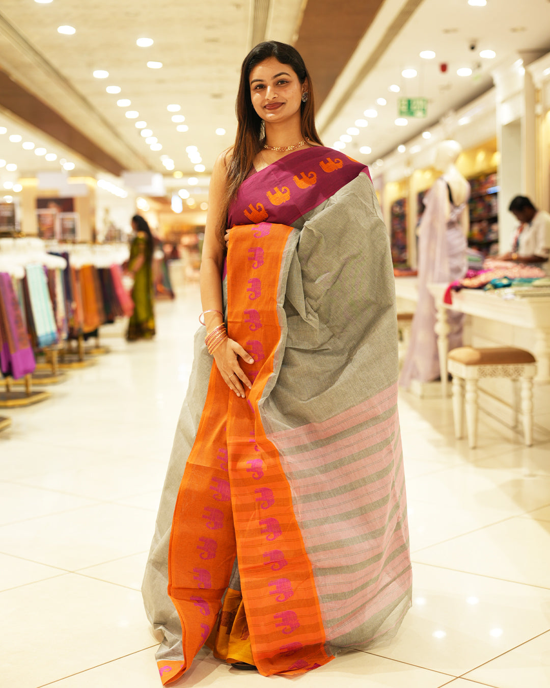 Pink with Orange Bengal cotton saree featuring Ganga Jamuna Style Contrast Border with elephant motifs, Striped pallu.
