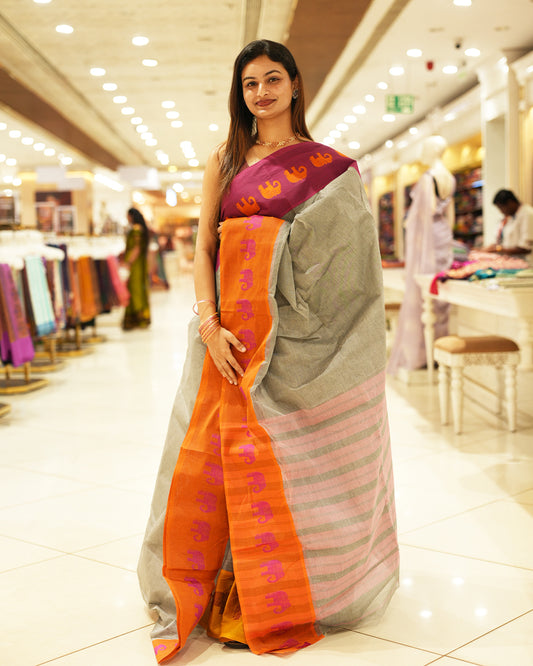 Pink with Orange Bengal cotton saree featuring Ganga Jamuna Style Contrast Border with elephant motifs, Striped pallu.