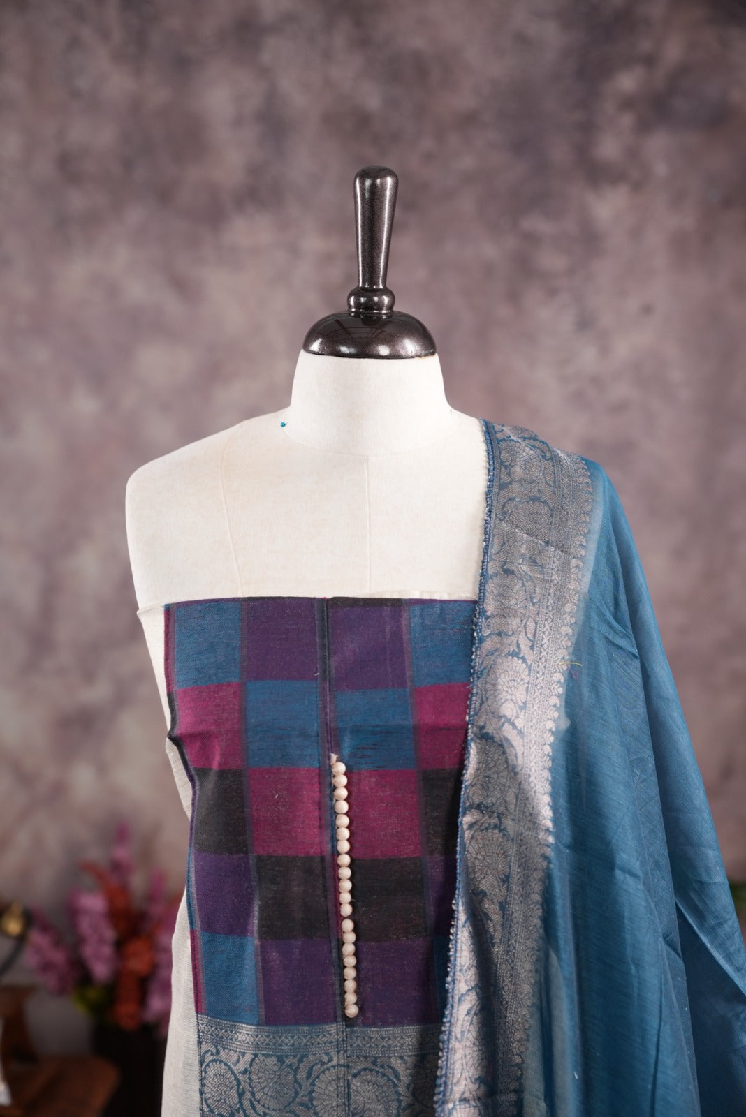 Peacock Blue colour tissue Madras check salwar material featuring a plain body with a classic Kasavu border, paired with a Chanderi dupatta adorned with a matching Kasavu border and a Shantoon fabric bottom.
