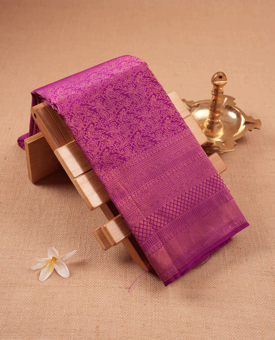 Vadamalli colour Kancheepuram saree featuring an antique zari brocade body, complemented by a traditional border and a matching blouse.