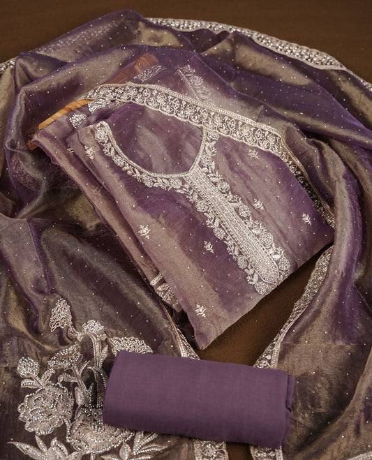 Purple and gold double shade colour churidar set with stone and thread embroidery and detailing, paired with matching pant and dupatta.