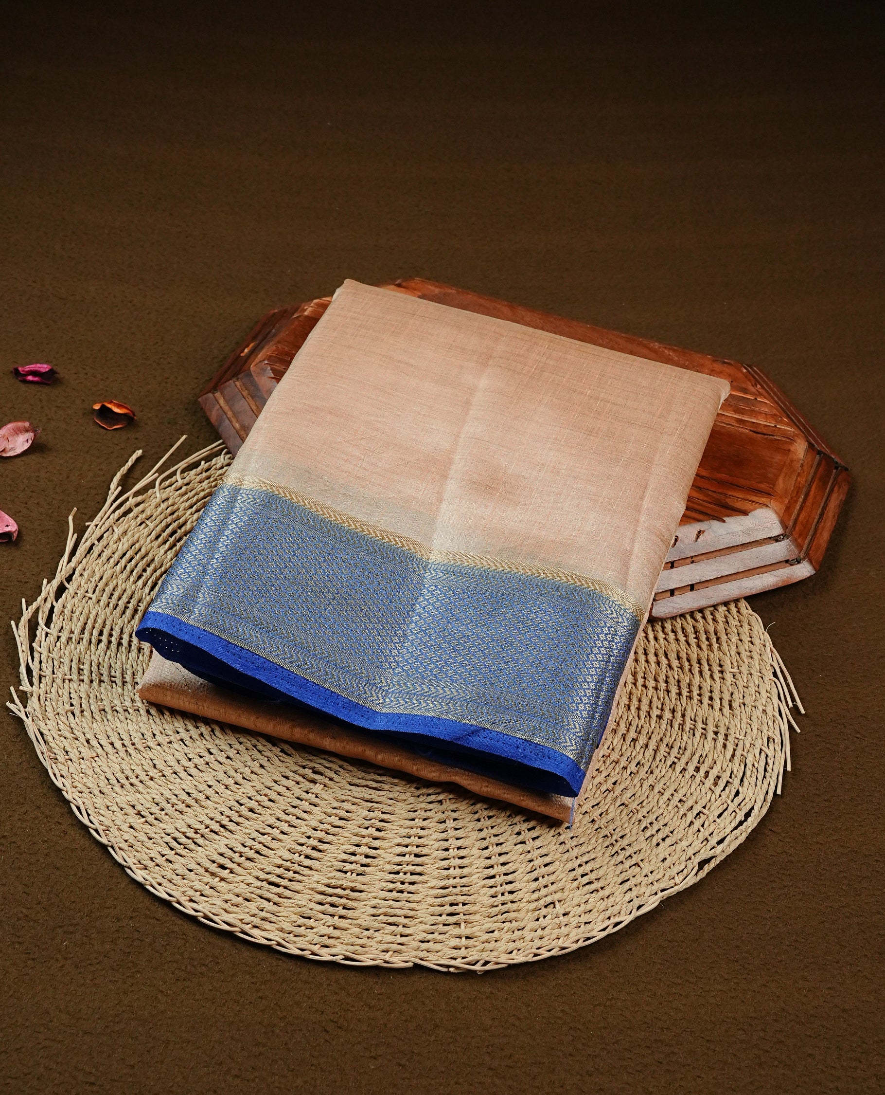 Light Gold Tussar saree featuring Gold zari buttas on body, complemented by contrast Blue Colour with Gold zari border, comes with matching blouse piece.