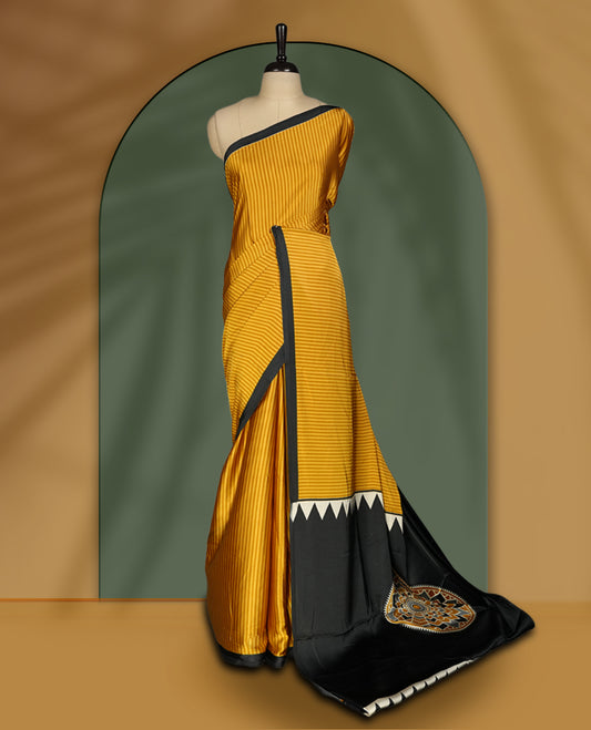 Mustard yellow colour striped saree with a bold black border and geometric pallu featuring a Madhubani style motif and paired with blouse.