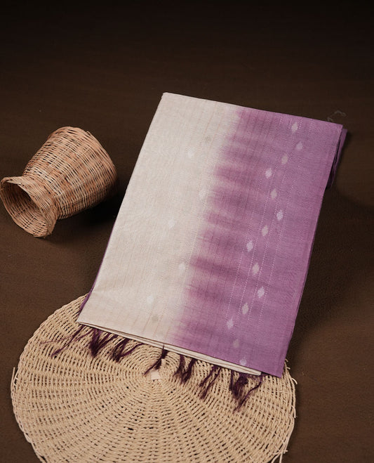 Cream & Purple dye pattern colour semi jute saree highlighting white stripped body, without border and paired with matching blouse.