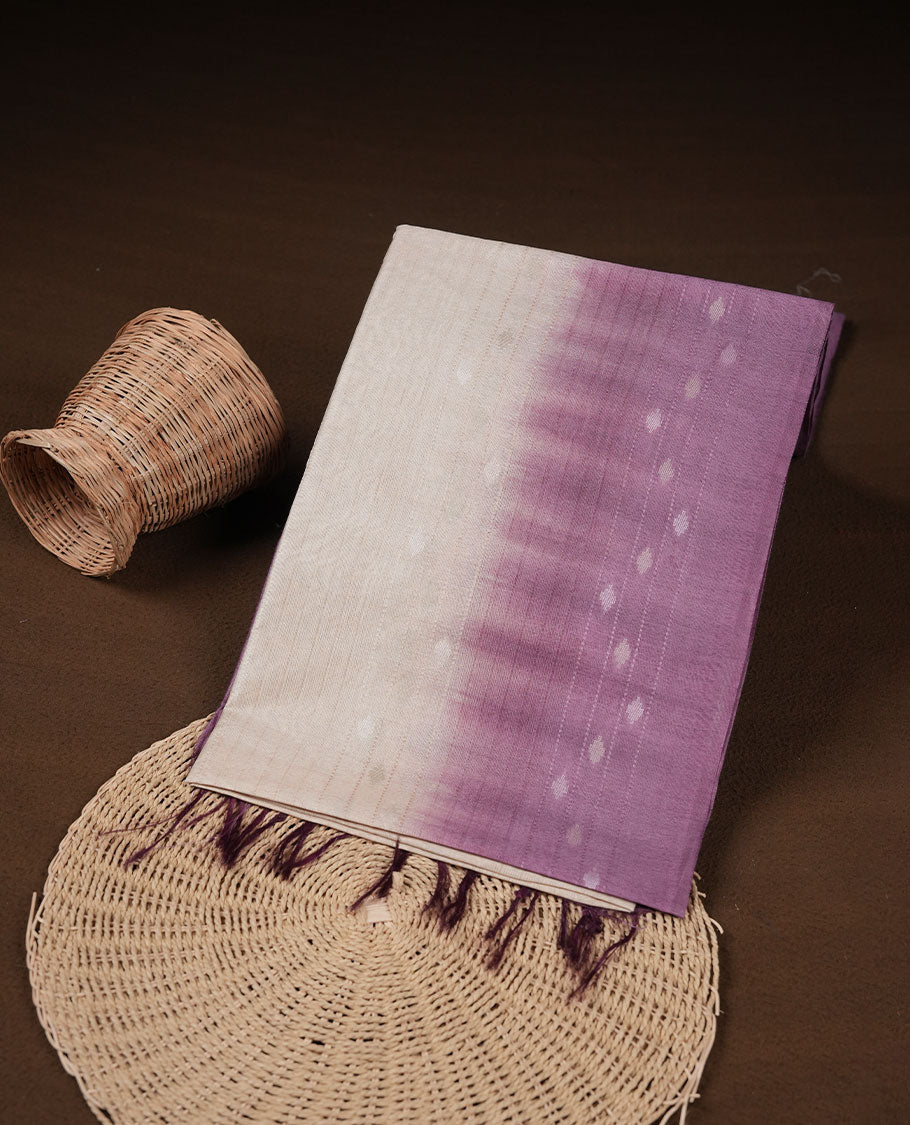 Cream & Purple dye pattern colour semi jute saree highlighting white stripped body, without border and paired with matching blouse.