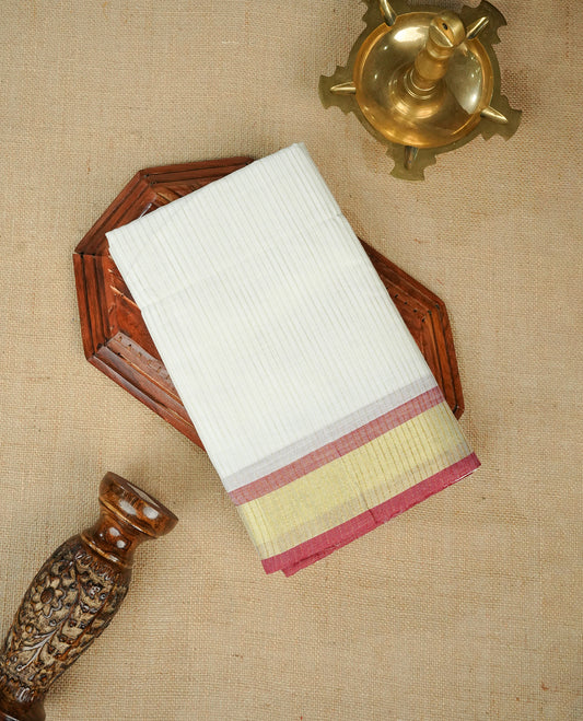 White colour chettinad cotton saree Featuring Gold zari Strips on body, complemented by contrast Maroon colour with zari border, comes with matching blouse piece.