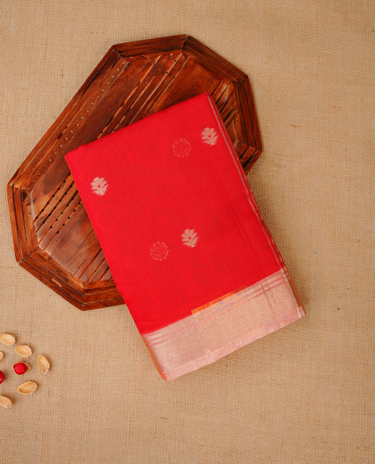 Red colour Maheshwari cotton saree, gold zari floral motifs on body, complement peach colour gold zari border comes with matching blouse.