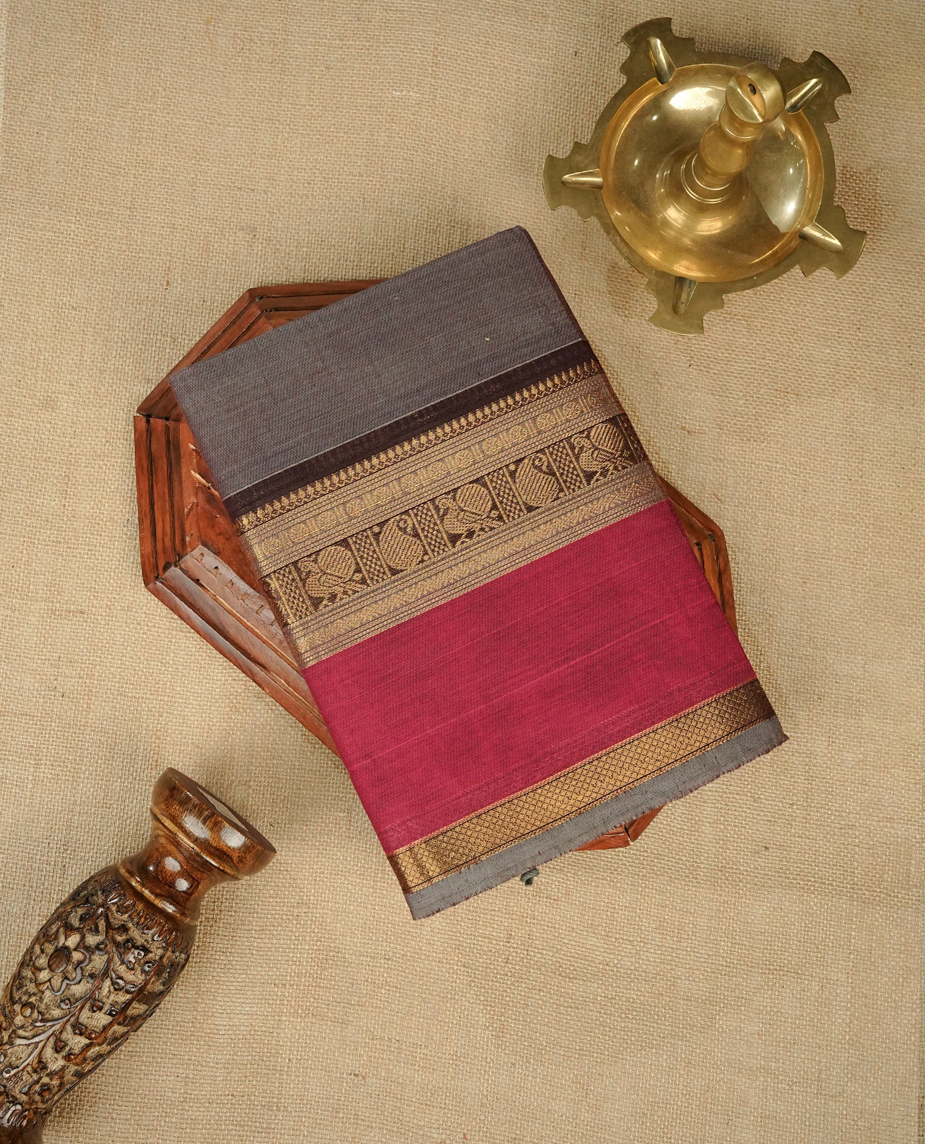 Grey colour chettinad cotton saree featuring Elegant plain body, Contrast Chocolate & Magenta colour with Gold zari border, comes with matching blouse piece.