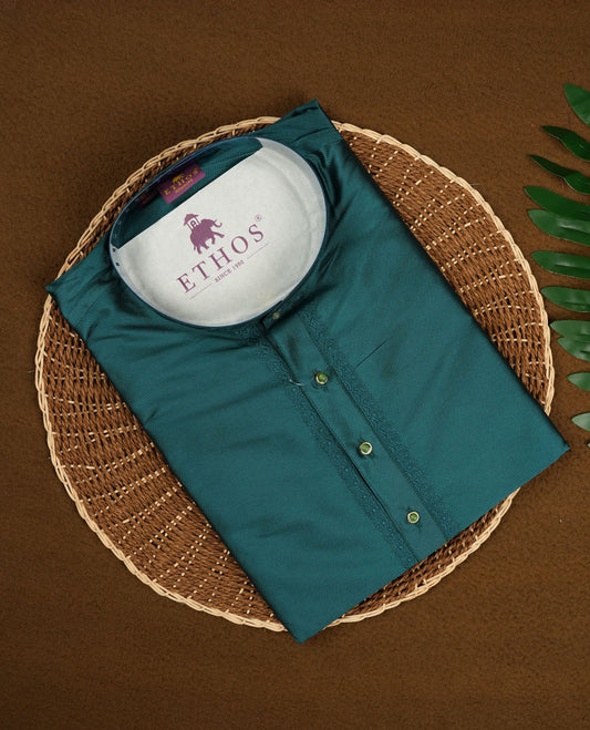 Rich teal blue colour mens kurta featuring elegant embroidery on the neckline & Crafted in a refined style with full sleeves, offering a perfect blend of tradition.