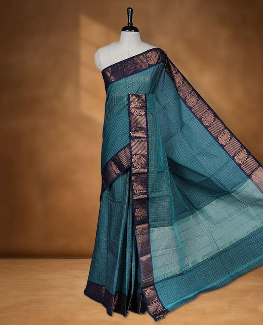 Teal colour sungudi cotton saree featuring gold zari check pattern across body, contrast Dark blue colour with gold zari pattern on border, without blouse piece.
