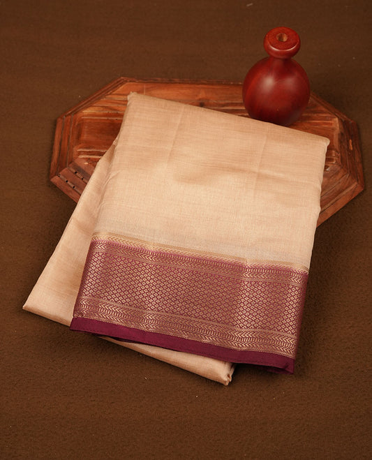 Cream colour tussar silk saree featuring elegant plain body, contrast Maroon colour border with gold zari, comes with matching blouse piece.