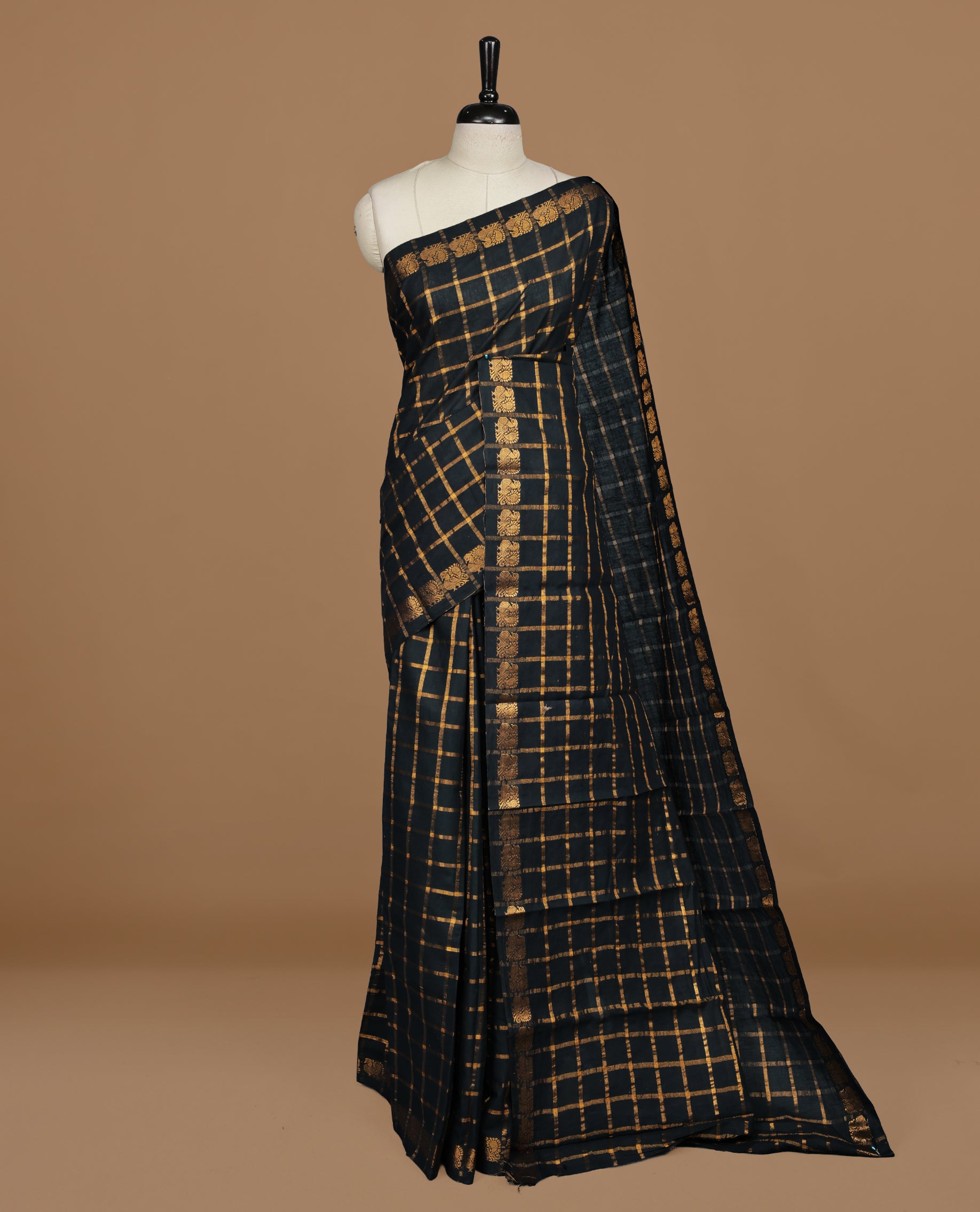 Black colour Sungudi cotton saree featuring Gold zari Check pattern on body, Gold zari Peacock design on Self colour border, paired with matching blouse piece.