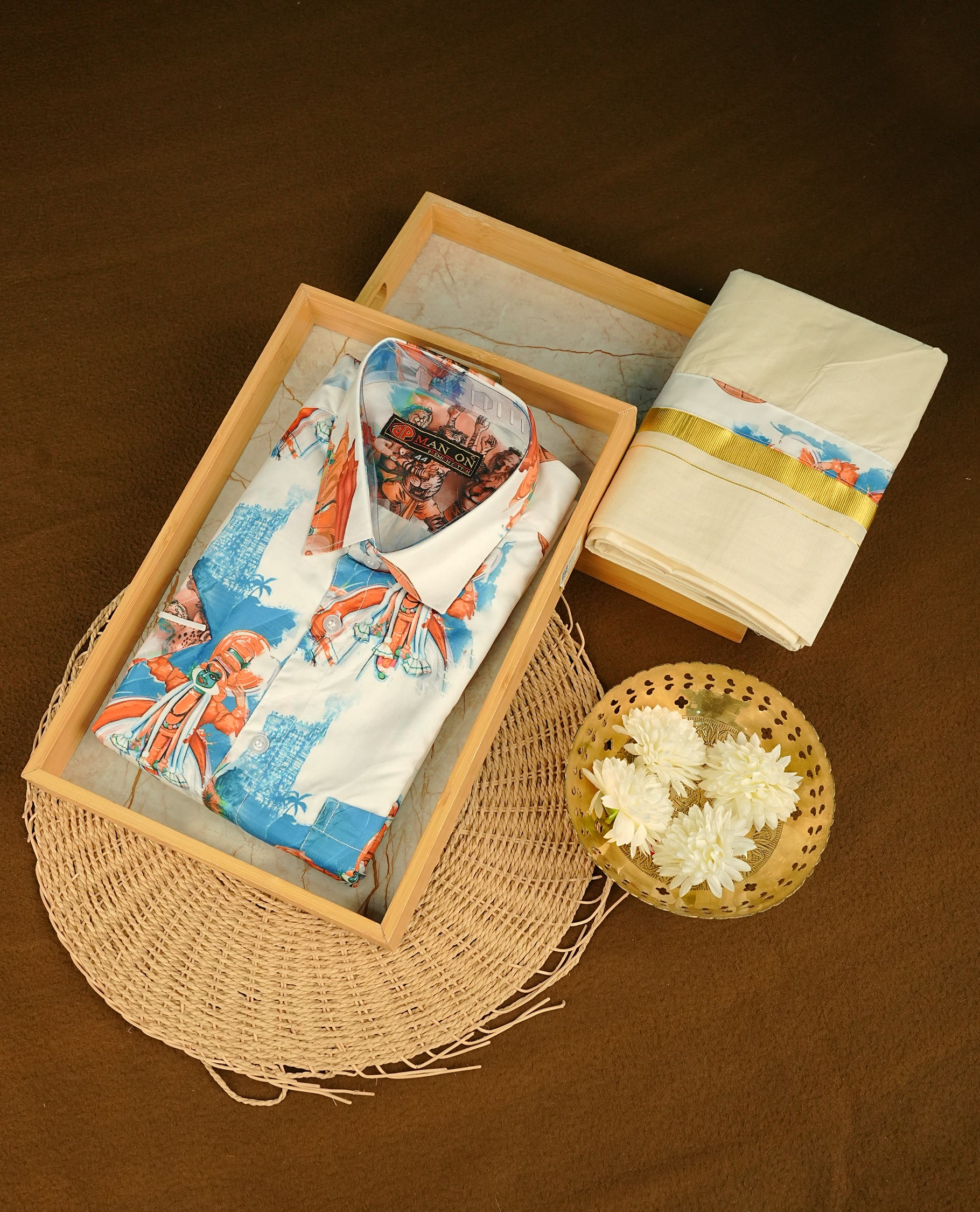 Cream colour shirt featuring  Indian art from printed body, paired with cream colour double dhoti featuring a gold kara with Same printed border.