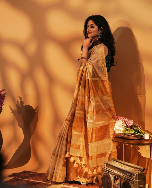 Golden Khadi Tissue Saree Featuring Bold gold stripes on body, Complemented by Kasav border for Onam special