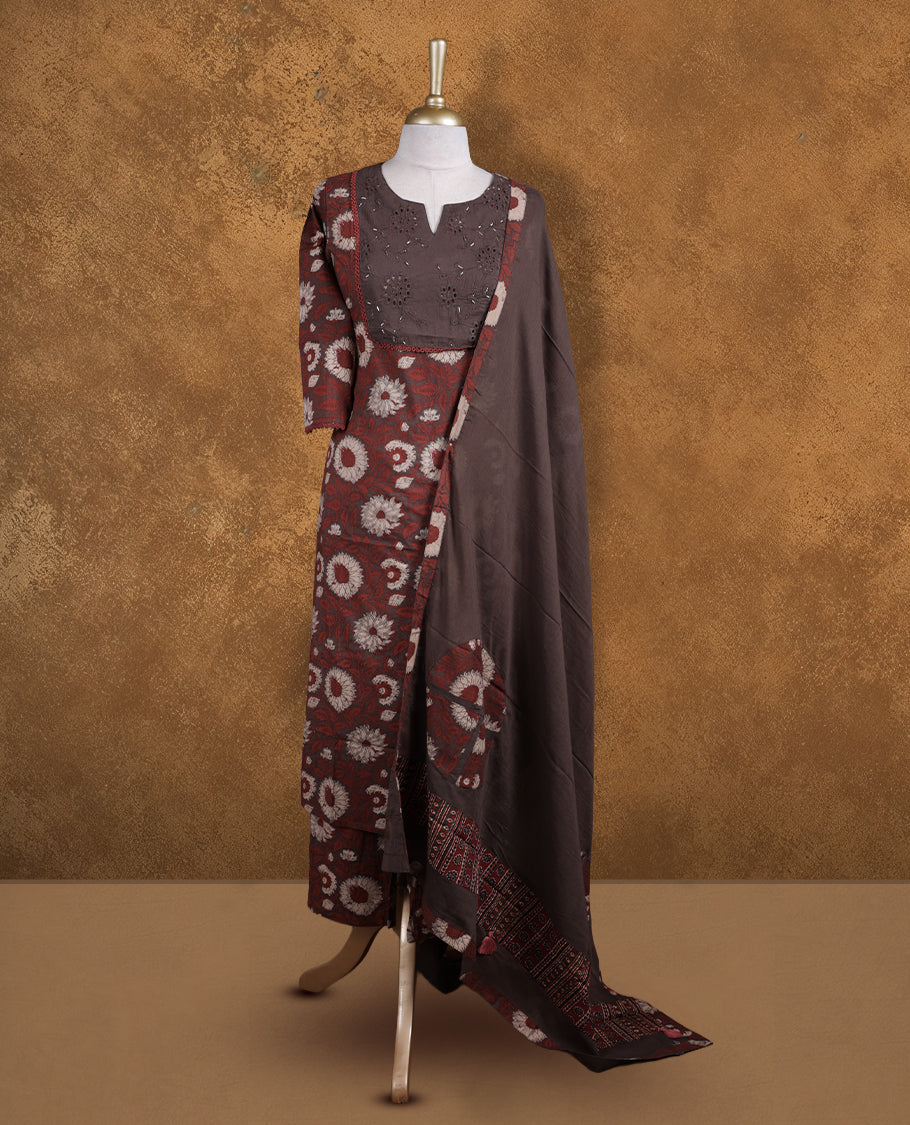 Dark brown colour churidar set featuring elegant Light gold cut beat embroidery on the neckline, sleeves, and floral pattern across the body, Paired with a matching dupatta