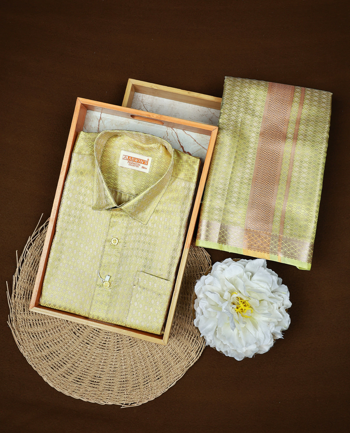 Pista green colour  ASWIN'S shirt paired with a matching dhoti, finishing with a Gold border